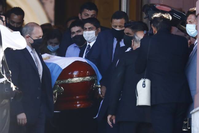 The flag-draped casket of Diego Maradona is carried to a waiting hearse after lying in state at the presidential palace in Buenos Aires, Argentina. Image: PA Images