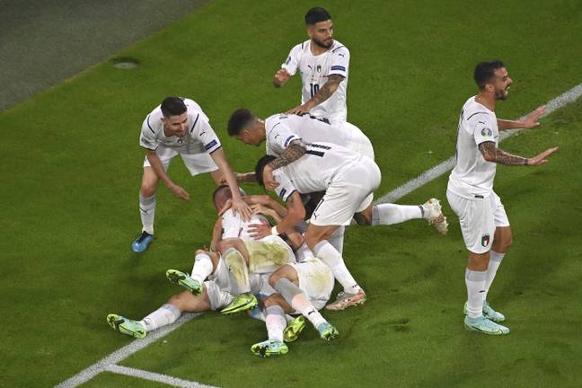 Italy players, including Immobile, mob Barella after he scored. Image: PA Images