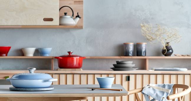 The range features cast iron woks and casserole dishes, stoneware plates and gorgeous serveware (Credit: Le Creuset)