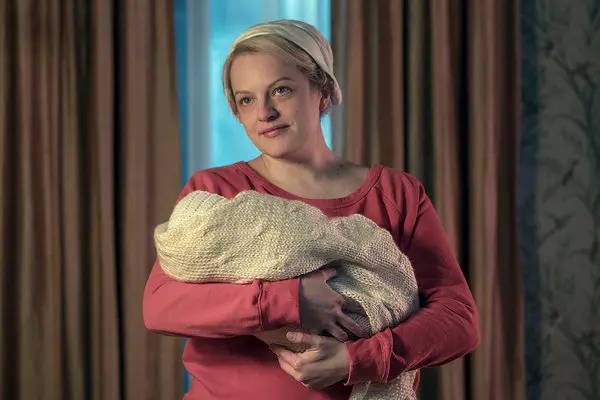 At the end of Season 3, June Osborne, played by Elisabeth Moss, helped children escape Gilead by plane (Credit: Netflix)