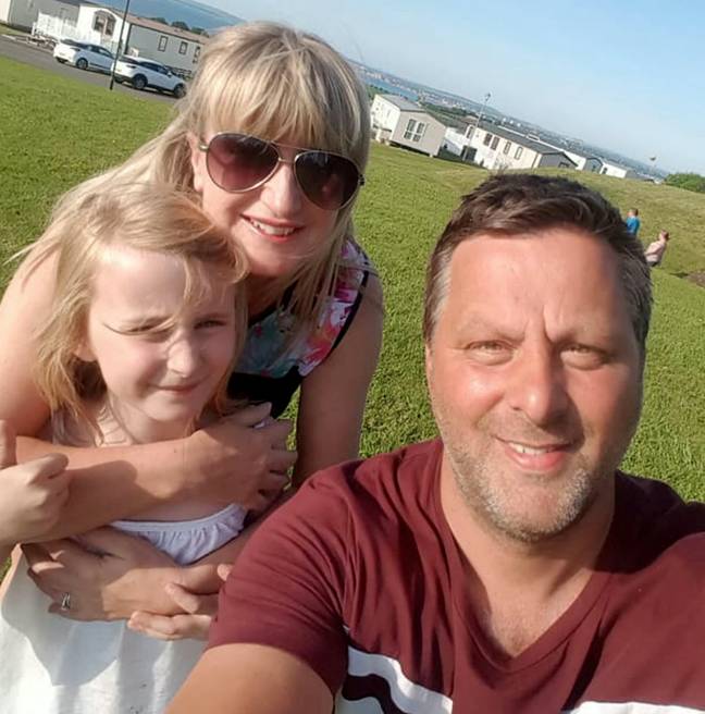 Maisy with parents Chris and Sharon. Credit: SWNS