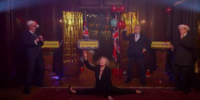 Theresa does the splits at one point (Credit: Robbie Williams/YouTube)