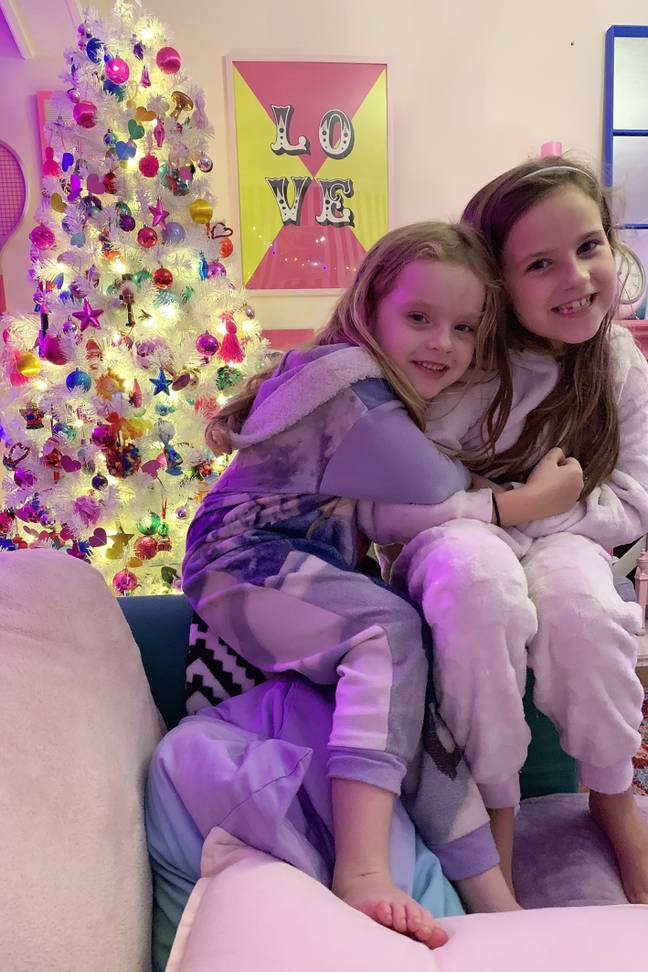 Rachael's daughters Gabriella, 8, and Florence, 5, naturally adore their home (Credit: Caters)