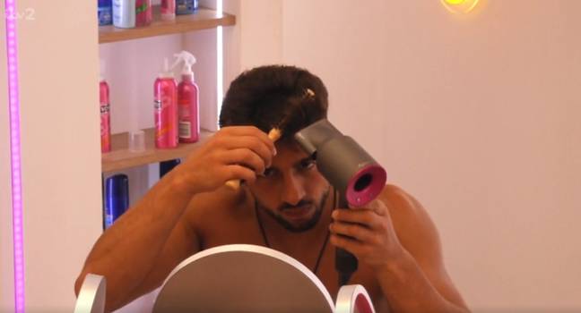 Marvin curls his quiff with a round brush and hairdryer. Credit: ITV