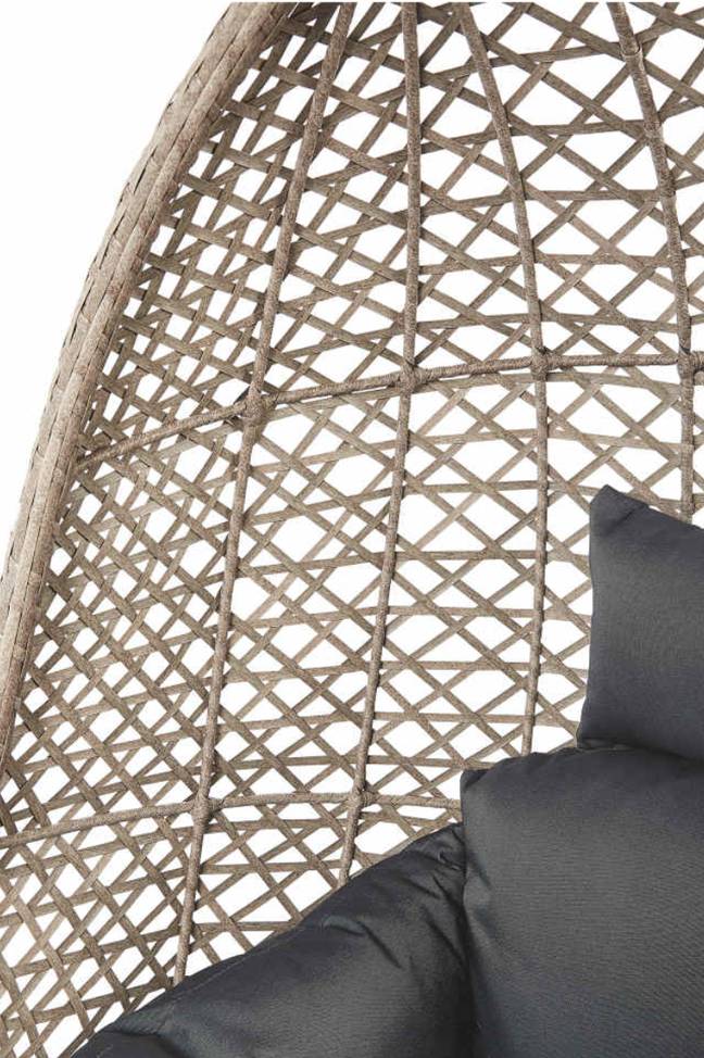 The chair features stylish rattan, with deep grey cushions and a sturdy frame (Credit: Aldi)