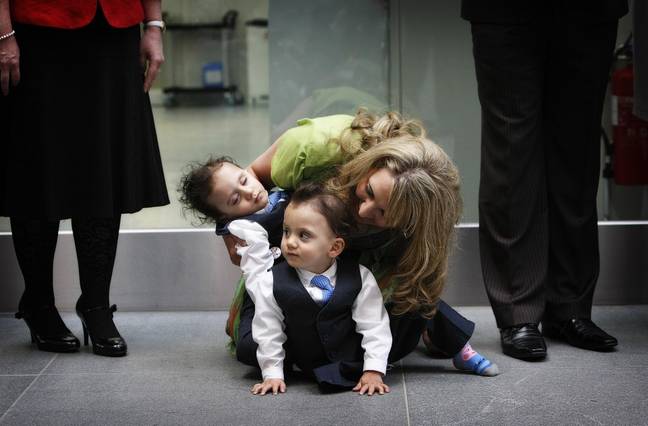 The twins with their mum Angie in 2011. Credit: PA