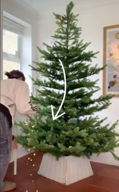 Clare demonstrates the correct way to hang your tree lights (Credit: TikTok/mrsclarehoops)