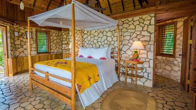 Sleep in a four poster bed below a netted canopy (Rockhouse Resort &amp; Spa)