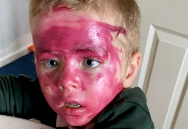 Rowan rather liked his mum's pink lipstick (Credit: SWNS) 