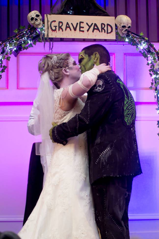 The couple said their vows in front of a ghoulish graveyard backdrop. (Credit: SWNS)