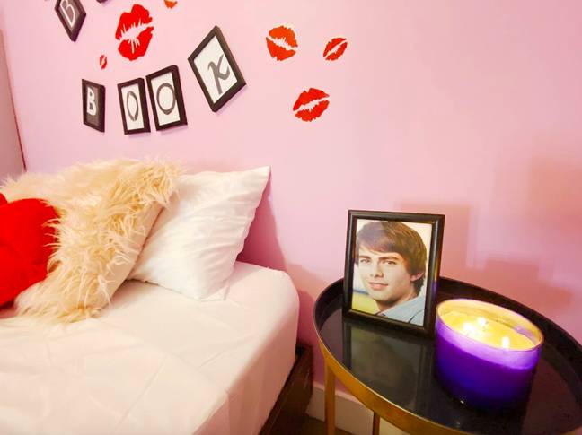 An Aaron Samuels photo by the bedside? Dreamy (Credit: Airbnb)