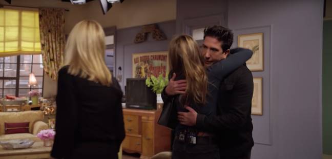 Jennifer Aniston and David Schwimmer hug during the cast's emotional reunion (Credit: HBO Max)