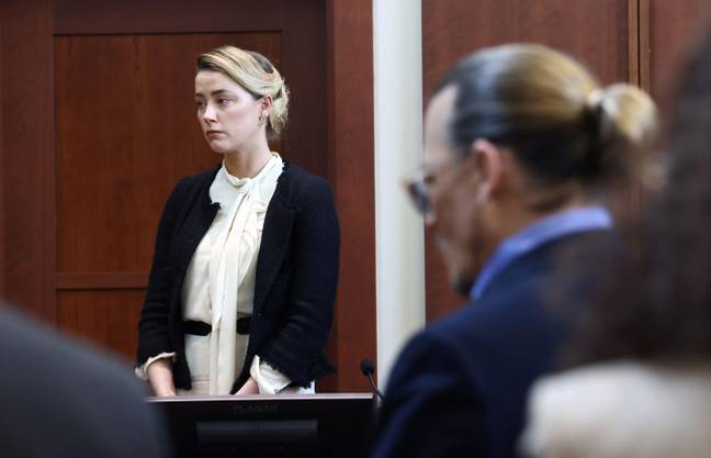 Amber Heard was asked to explain why Johnny Depp does not look at her in court. (Credit: Alamy)