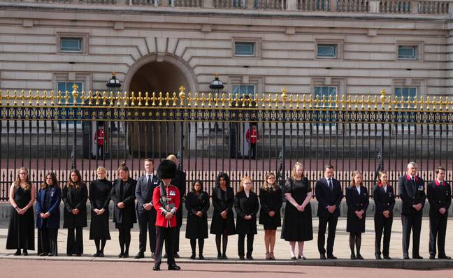 Buckingham Palace staff paying their respects to the Queen. Credit: PA / Carl Court / AP