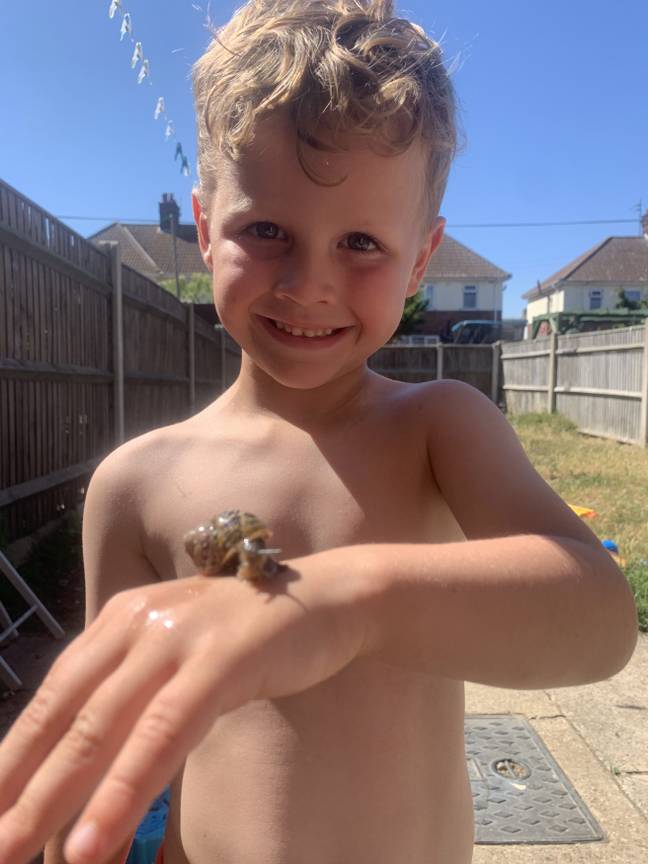 Five-year-old Rye is a big animal lover and snails are no exception. Credit: Kennedy News and Media