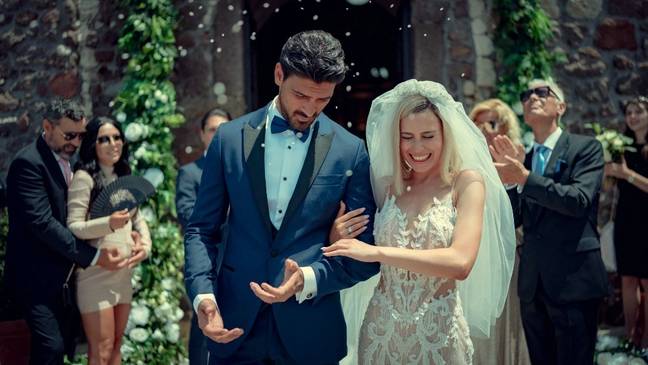 Laura and Massimo married earlier in the film, although that doesn't stop a love triangle from emerging (Credit: Netflix)