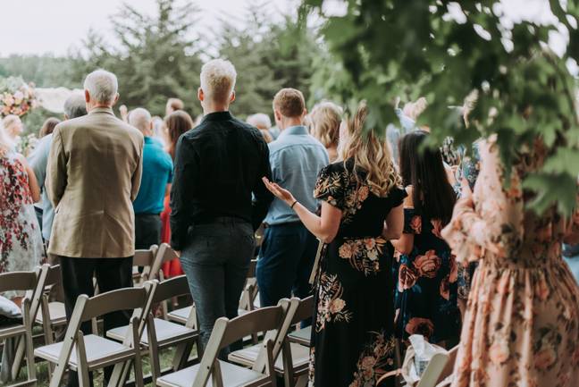 Reddit users were outraged and defended the wedding guest (Credit: Unsplash)