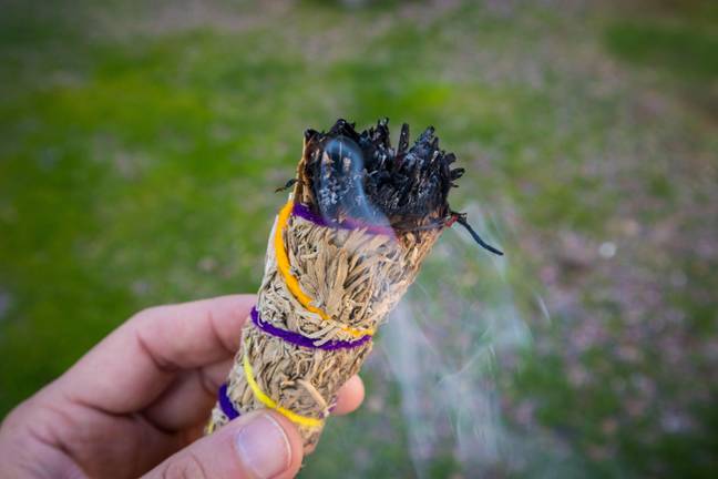 The mum took to burning sage in a hopes to rid the 'creepy ghost'. Credit: TikTok