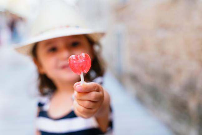 A mum has issued a warning over sour lollipops after her child suffered a devastating burn to their tongue (Credit: Alamy)