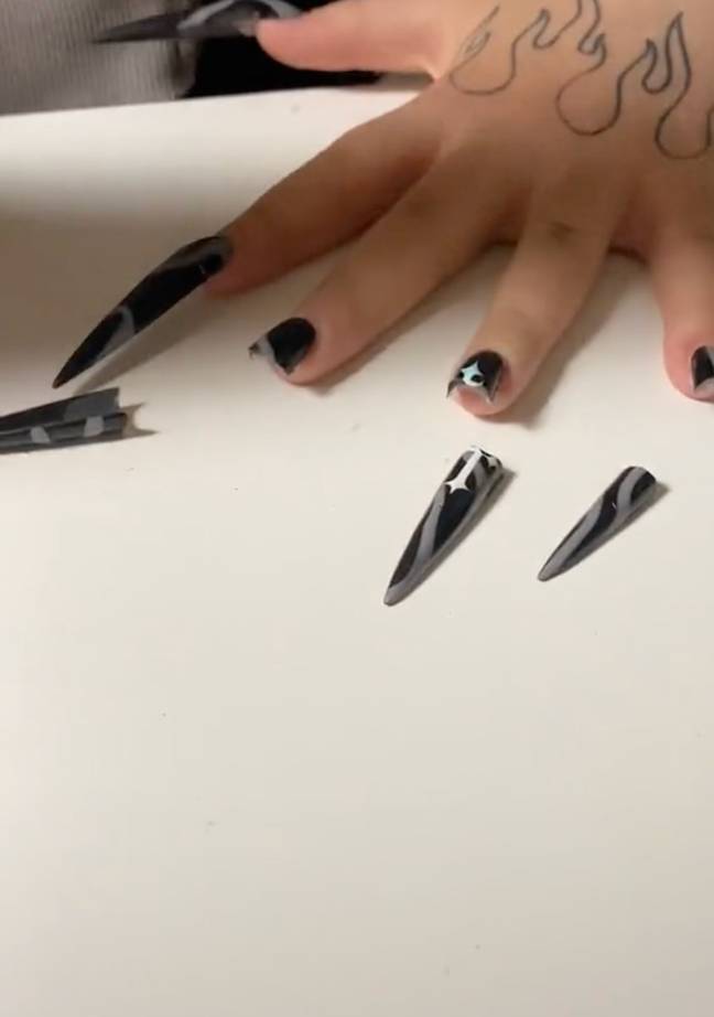 Nail tech Anna has a rather bizarre nail removal technique. (Credit: TikTok/@trash.nailsss)