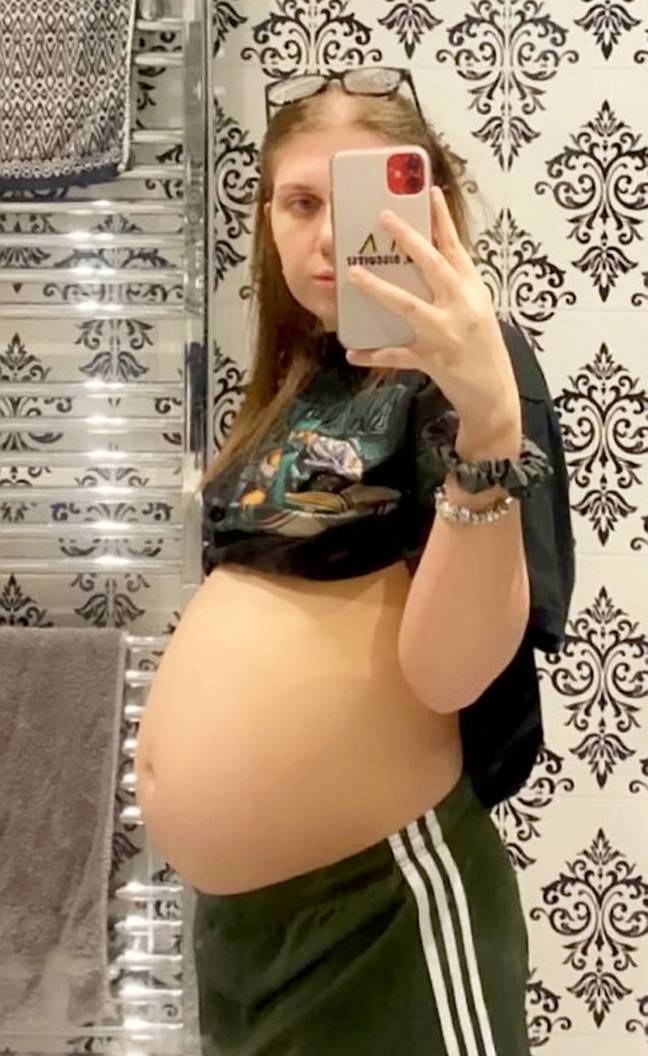 Hollie thought she was pregnant when her stomach started to grow. Credit: SWNS