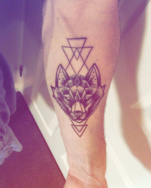 The wolf tattoo is on his arm. Credit: @andrewlepage/Instagram.