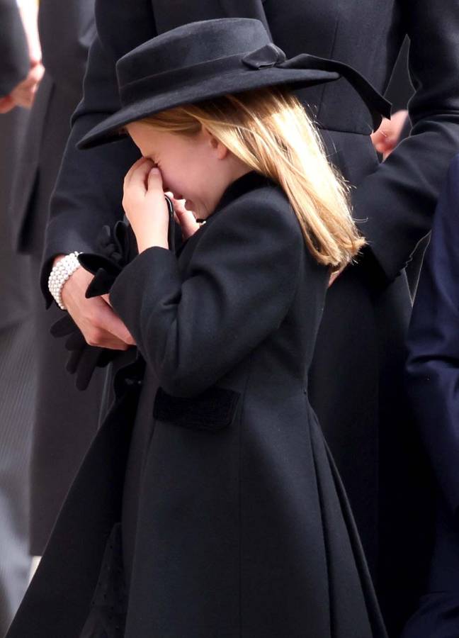 Princess Charlotte bravely followed her great-grandmother's coffin today. Credit: Mirrorpix