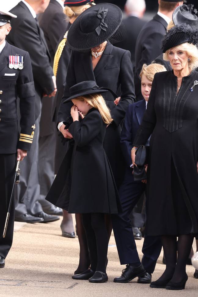 Princess Charlotte was comforted by her mother. Credit: Mirrorpix