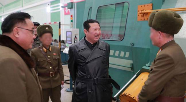Kim Jong-un in a leather trench coat. Credit: Alamy
