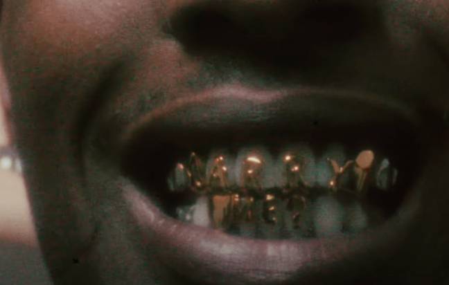 A$AP Rocky's grills in his D.M.B music video read, 'Marry me'. Credit: ASAPROCKYUPTOWN/ YouTube