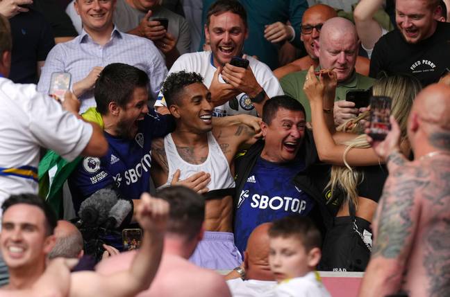 Raphina celebrates with the fans. Image: PA Images