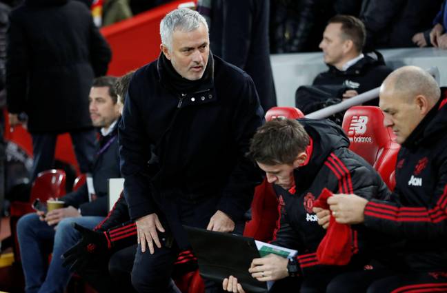 Mourinho in conversation with his coaching staff. (Image Credit: Alamy)