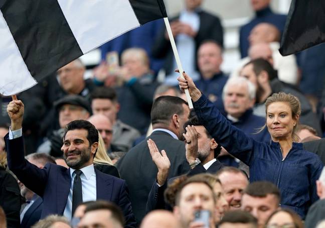 Newcastle Chairman Yasser Al-Rumayyan and Director Amanda Staveley wave flags.  Photo: scientific