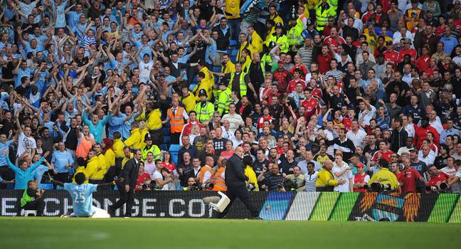 Adebayor celebrates in front of Arsenal fans. Image Credit: Alamy