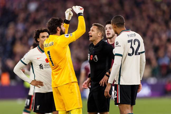 Alisson argues with Pawson during the loss to West Ham. Image: PA Images