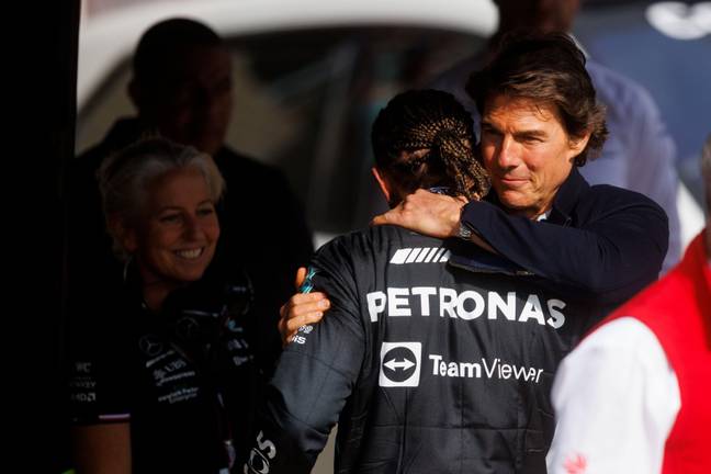 Hamilton and Cruise embrace at the British Grand Prix earlier this year. (Image Credit: Alamy)