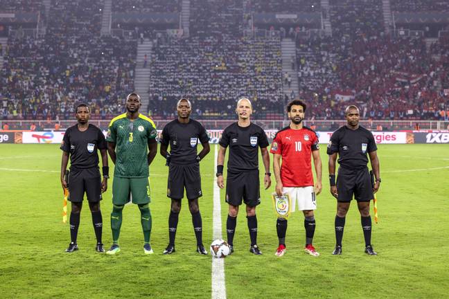 Senegal's Kalidou Koulibaly and Egypt's Mohamed Salah with official referee Victor Gomes pose for a photo during the Africa Cup of Nations final between Senegal and Egypt.  Image: Alamy