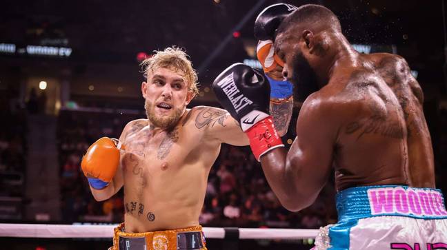 Jake Paul continued his fledgling boxing career with a split decision victory over Tyron Woodley