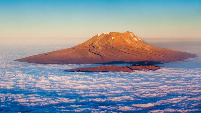 Aerial view of Mount Kilimanjaro lit by the setting sun. (Alamy)