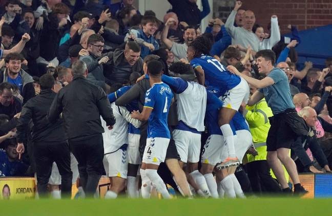 Fans and teammates jump on Calvert-Lewin after his 85th minute winner. Image: PA Images