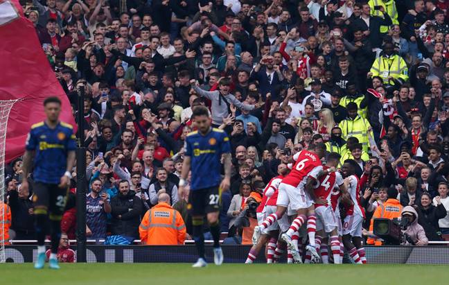 United players look dejected as Arsenal celebrate in a recent win over Ragnick's side. Image: PA Images