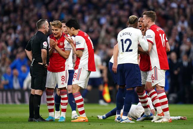 Arsenal players plead with the ref not to send Holding off. Image: PA Images