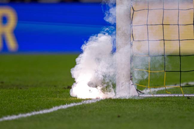 Fireworks were also thrown on the pitch. Image: PA Images