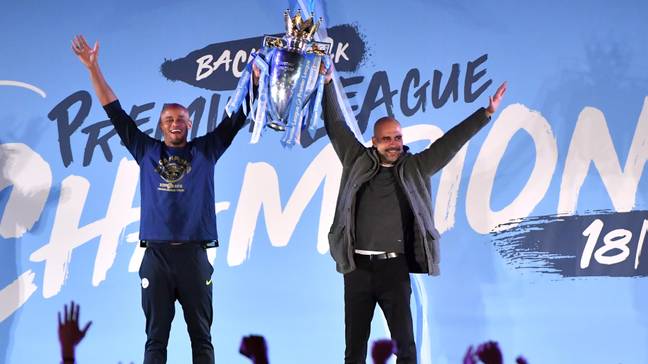 Vincent Kompany and Pep Guardiola on stage with the Premier League trophy (Image: PA Images/Alamy)
