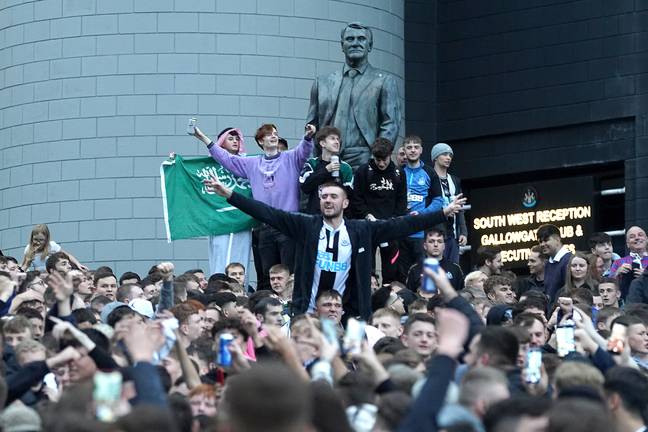 Newcastle fans celebrating their new owners. Image: PA Images