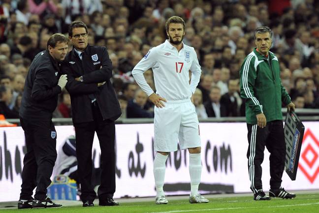 Beckham about to come on as a substitute during Capello's reign. Image: PA Images