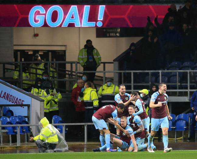 Burnley players celebrate Mee's winner. Image: PA Images