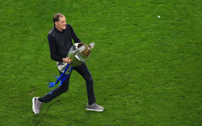 Chelsea manager Thomas Tuchel celebrates with the trophy after the UEFA Champions League final match held at Estadio do Dragao in Porto. (Alamy)