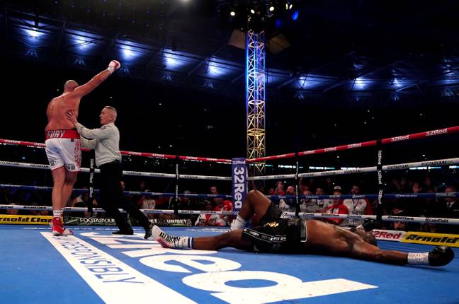 Fury celebrates after knocking Whyte down in the sixth. Image: PA Images