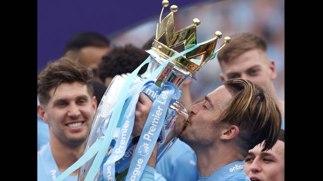 Jack Grealish celebrates winning the Premier League trophy with Manchester City (Image: Alamy)